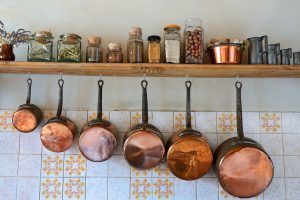 Copper pans hanging in kitchen